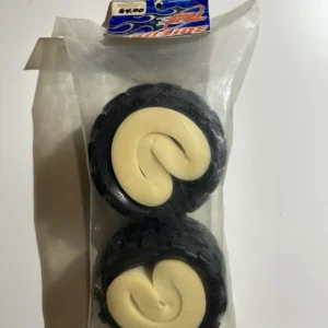Two foam-topped tires in a packaging.